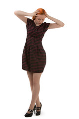 Stylish young woman holding her head