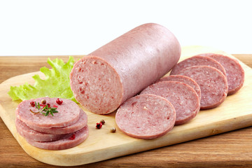 Salami sausage on wooden cutting board