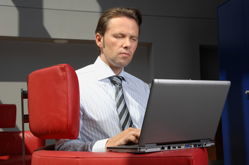Business Man Working With Laptop In A Meeting Room