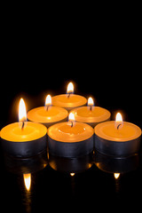 candle triangle on a black background