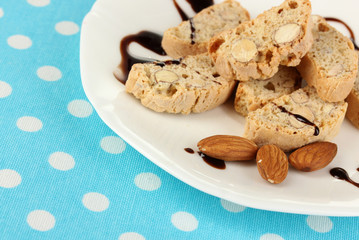 Aromatic cookies cantuccini on plate on blue tablecloth