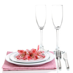 Festive table setting with flowers isolated on white