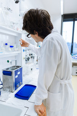 Young male researcher carrying out scientific research in a lab