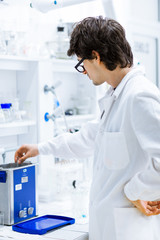 Young male researcher carrying out scientific research in a lab