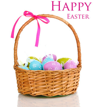 Colorful easter eggs in basket isolated on white