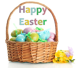 Bright easter eggs with bows in basket, isolated on white