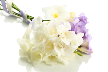 Naklejka na ściany i meble Beautiful bouquet of freesias, isolated on white