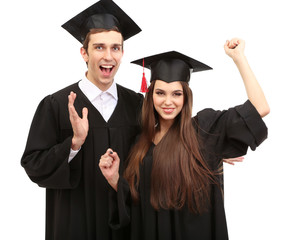 Two happy graduating students  isolated on white