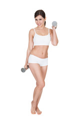 Fototapeta premium Young Woman Lifting Dumbbells