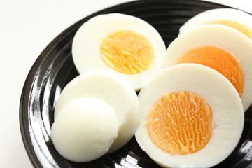 slided boiled egg on dish 