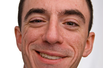 Fototapeta premium Caucasian Male Smiling Headshot - Extreme Closeup