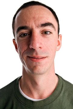 Caucasian Male Headshot With A Smirk On His Face