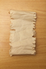 Old paper over vintage wooden surface