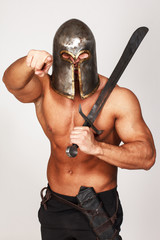 Fototapeta premium Angry warrior is pointing on someone