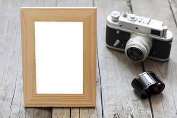 Old empty photos frame with retro camera background concept