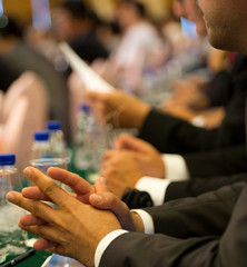 listening attentively at conference