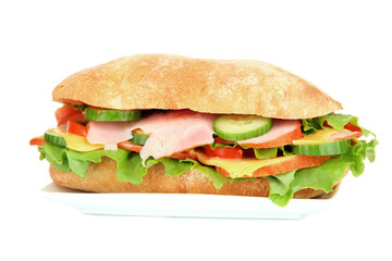 Fresh and tasty sandwich with ham and vegetables isolated