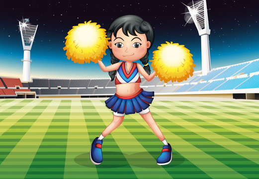 A cheerleader dancing in the stadium with her yellow pompoms