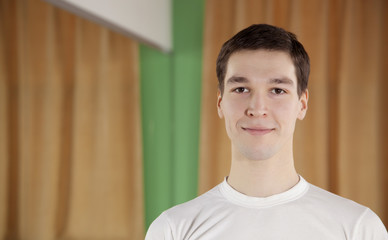 Obraz premium portrait of a handsome young guy in the gym