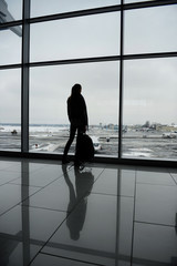 Fototapeta na wymiar Woman standing in the airport terminal