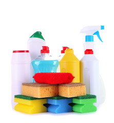 Different kinds of kitchen cleaners and colorful sponges,