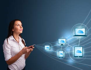 Pretty lady typing on smartphone with cloud computing