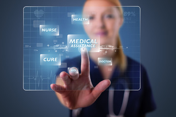 Young nurse pressing modern medical type of buttons