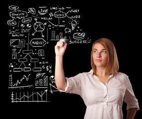 Woman drawing business scheme and icons on whiteboard