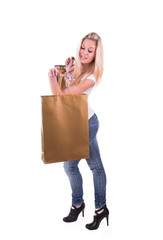 Fototapeta premium Smiling girl in shop with shopping bags 