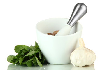 Mortar, herbs and garlic, isolated on white