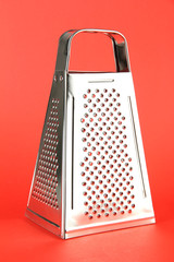 Metal grater, on color background