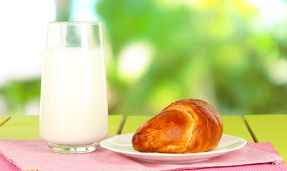 Bread roll and glass of milk
