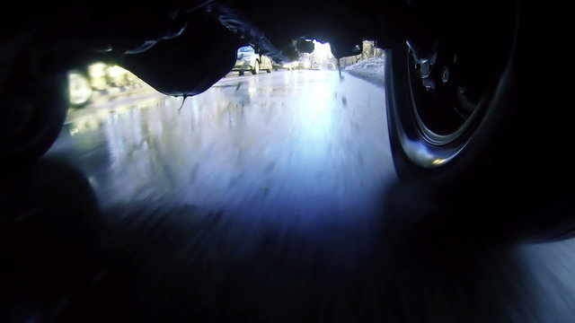 Driving through puddles. Loopable, view   under car. 1080p, vj.