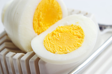 Hard boiled egg slices on slicer