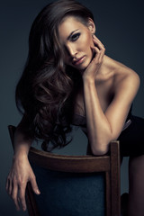 Vogue style photo of very delicate brunette woman