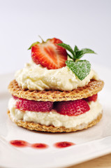 Sweet dessert - wafers with vanilla creme and strawberries