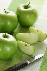 Sliced apples and knife