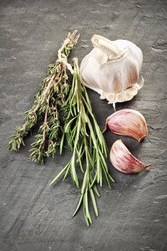 Herbs And Garlic On Gray Slate