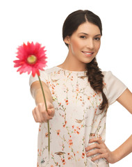 young and beautiful woman with flower