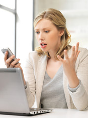 confused woman with cell phone
