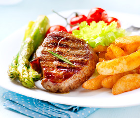 Grilled Beef Steak Meat with Fried Potato, Asparagus, Tomatoes