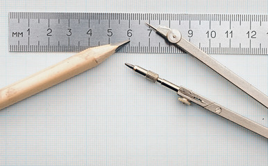 Geometry set with compass,pencil,ruler on graph paper