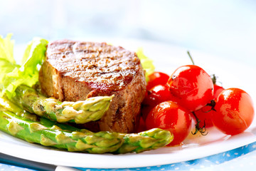 Grilled Beef Steak Meat with Fried Potato, Asparagus, Tomatoes