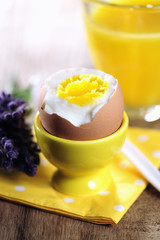 Hard boiled egg on yellow napkin