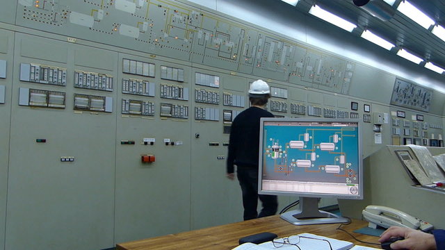 Industrial workers in a control room