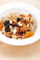 oatmeal with raisins, nuts and maple syrup