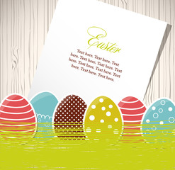 Easter eggs with grass and paper