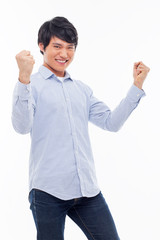 Young Asian man showing fist and happy sign.