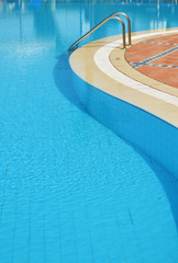 Swimming pool in touristic resort during summer time