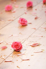Spa background of the wooden floor and some flowers and petals
